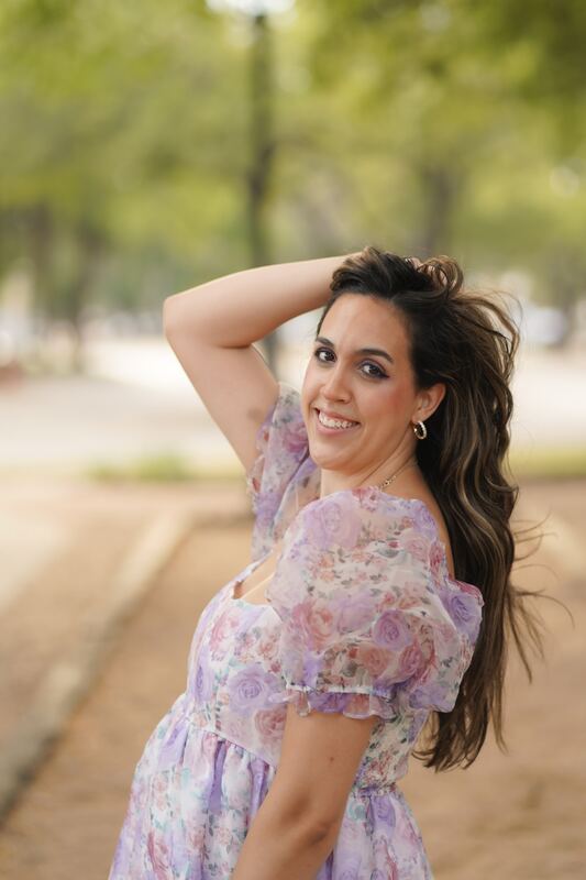 Portrait in a floral dress at an outdoor event