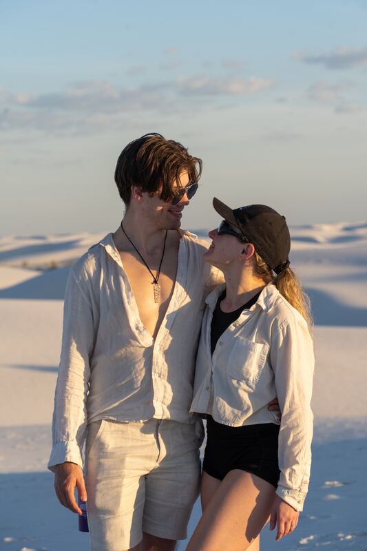 Couple standing close on the white dunes at White Sands