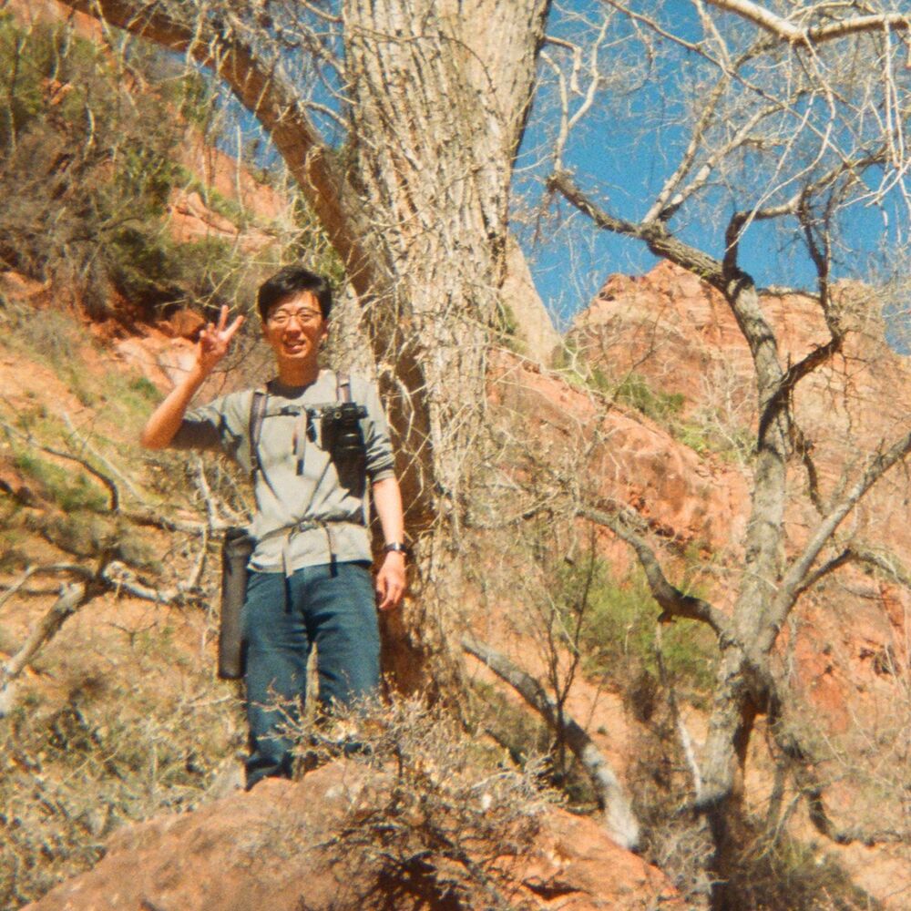 Zehao Xue at Zion, peace sign, on film